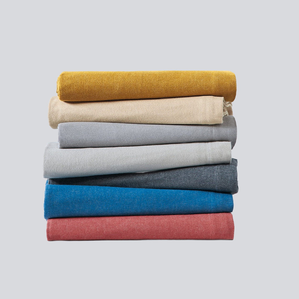 Linha Charming BellaGoma - conjunto de têxteis de cama dobrados. 