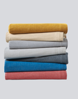 Linha Charming BellaGoma - conjunto de têxteis de cama dobrados. 