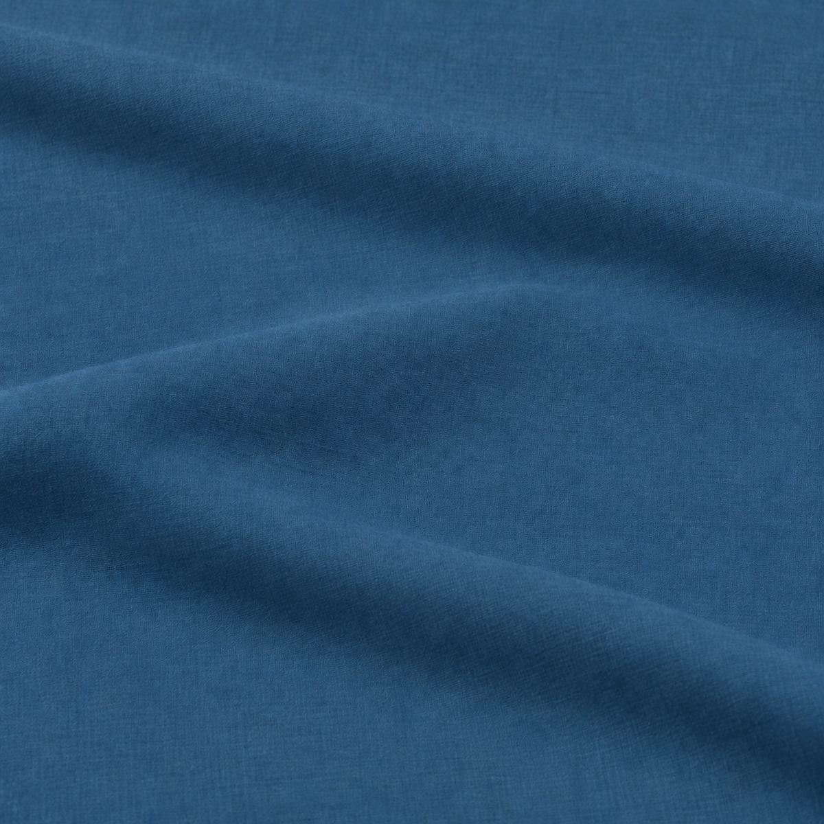 Pormenor do tecido azul do lençol ajustável Stone em percale 100% algodão.